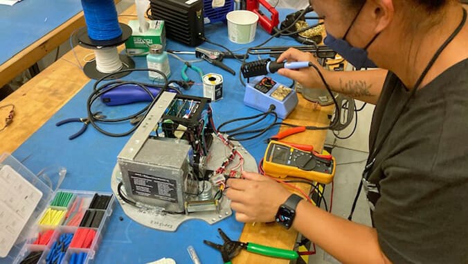 Student works on science payload