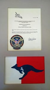 Kelso and Onizuka worked closely together on the mission team tasked with the preparation and deployment of the secret DoD payload. Their team adopted the kangaroo as their mascot. The flag underneath the certificate at left was given to Onizuka by Kelso and flown aboard STS-51C. Credit: PISCES.