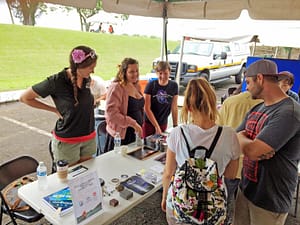 (L-R) PISCES Geologist Kyla Defore and Gemini Outreach Interns Jasmin Silva and Hannah Blomgren talk about stars and space exploration during the homecoming celebration. 