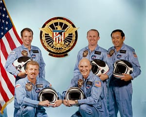 The crew of STS-51C: (L-R) Commander Thomas K. Mattingly, II, Pilot Loren J. Shriver, Mission Specialists Ellison S. Onizuka, James F. Buchli and Payload Specialist Gary E. Payton. Credit: NASA.