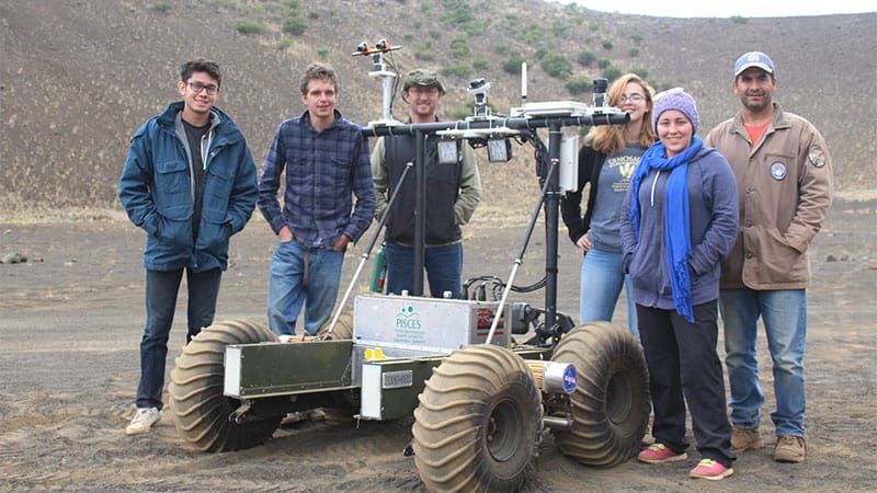 Students pose with their robotic rover project